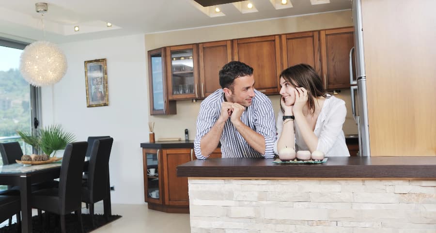 Young couple relaxing together in a stylish kitchen